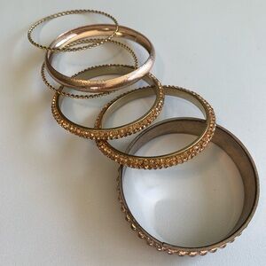 Set a six gold tone bangles. Perfectly coordinated.